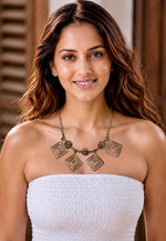 Sarita antique gold necklace with five square spiral labyrinth pendants on a slim brass chain, HeerMaya tribal jewellery